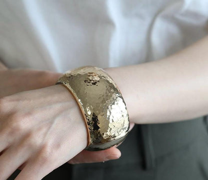 Hammered gold cuff bangle