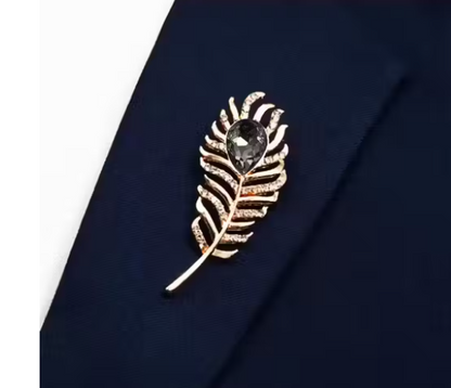 Metallic feather with black stone stud brooch