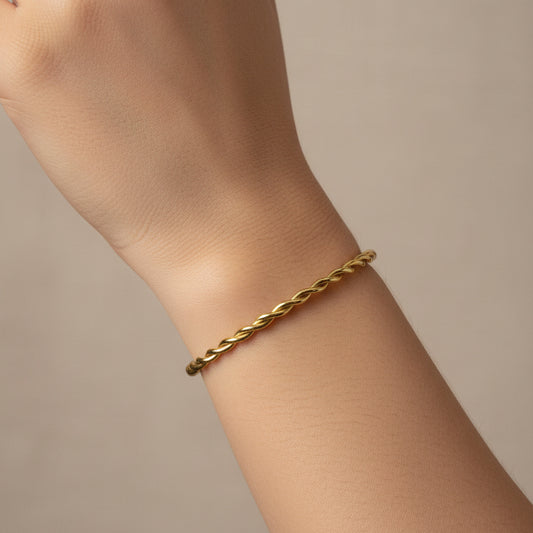 Twisted gold bangle